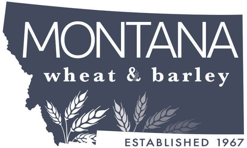 Logo shaped like the state of Montana with Montana wheat & barley written in white text and illustrated wheat and barley stalks below, plus Established 1967 at the bottom right.
